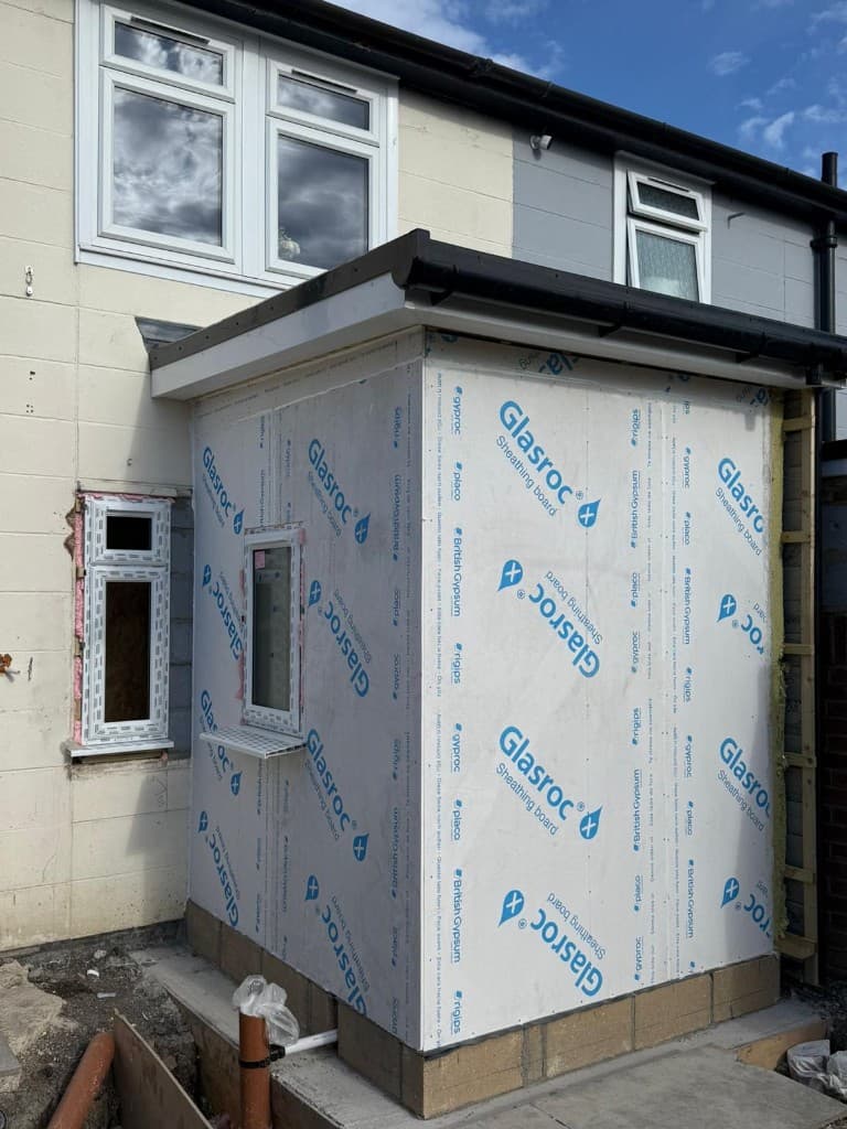 Brick extension adjacent to an existing garage on a residential property